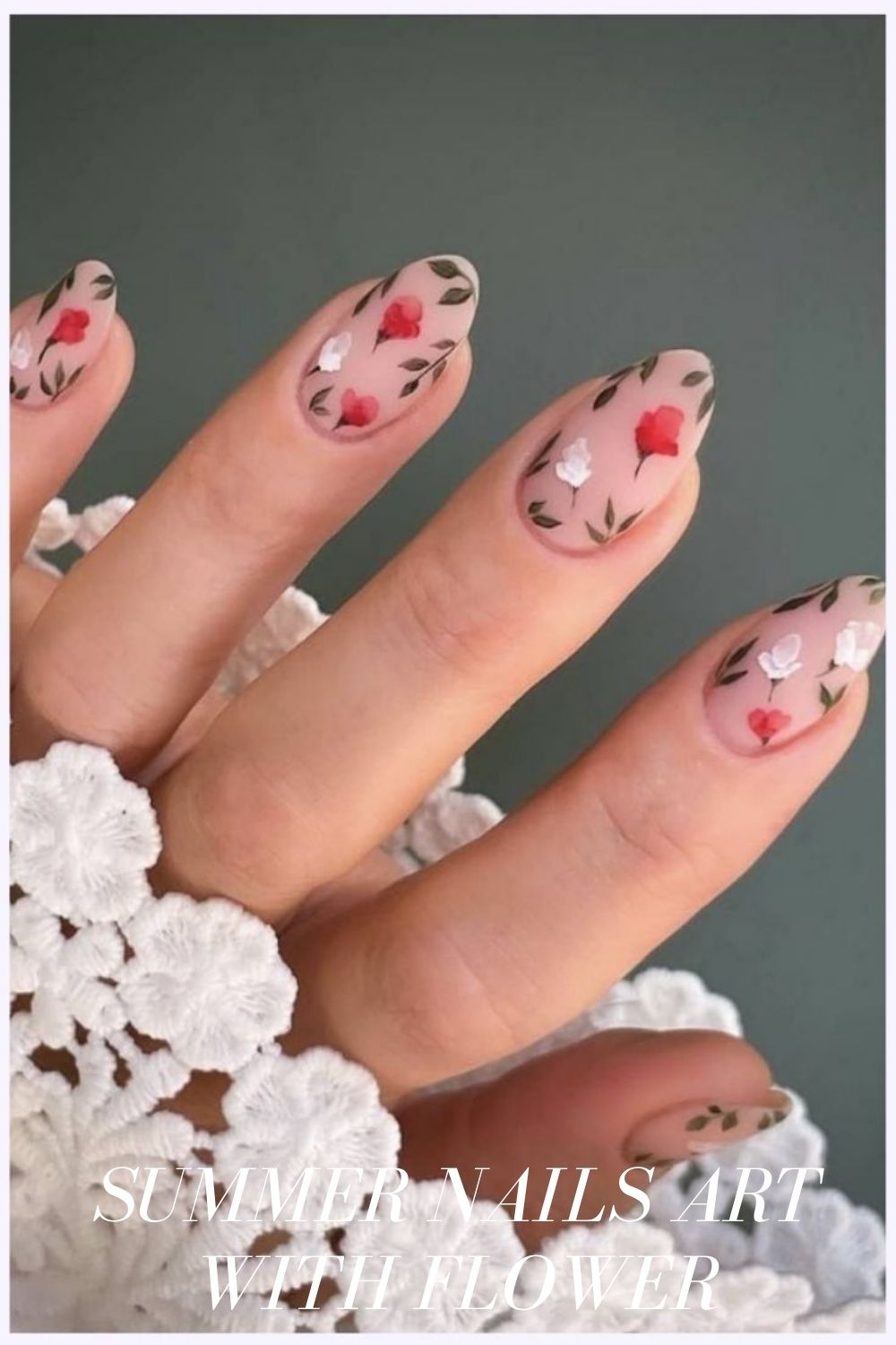 Short almond shaped nails with red and white flower nail designs