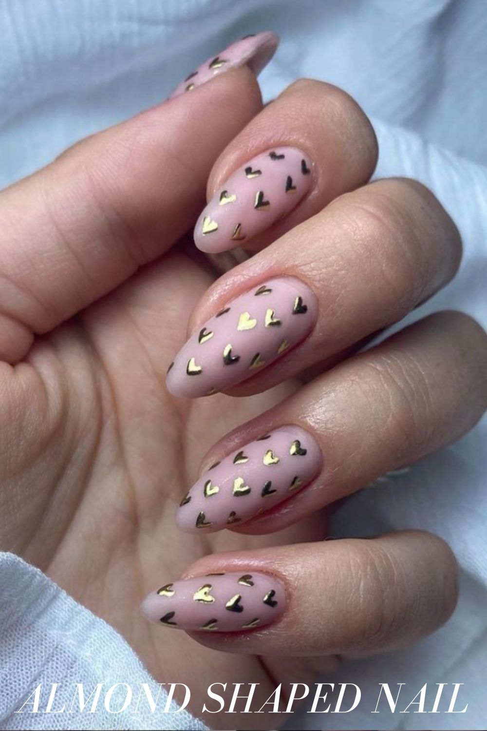 Gold heart almond nails