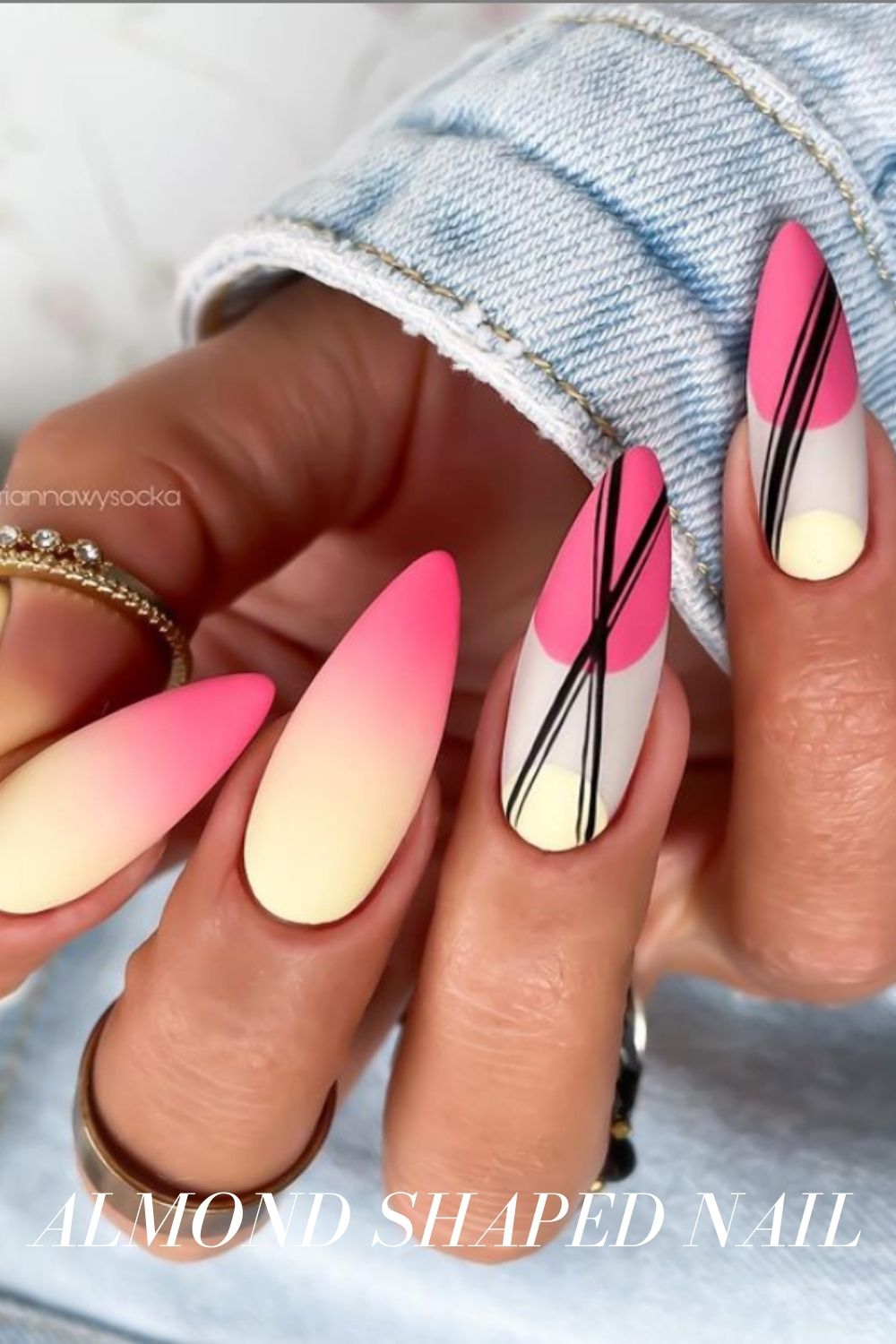 Pink And White Almond Nails With Gold V-Shaped Strips