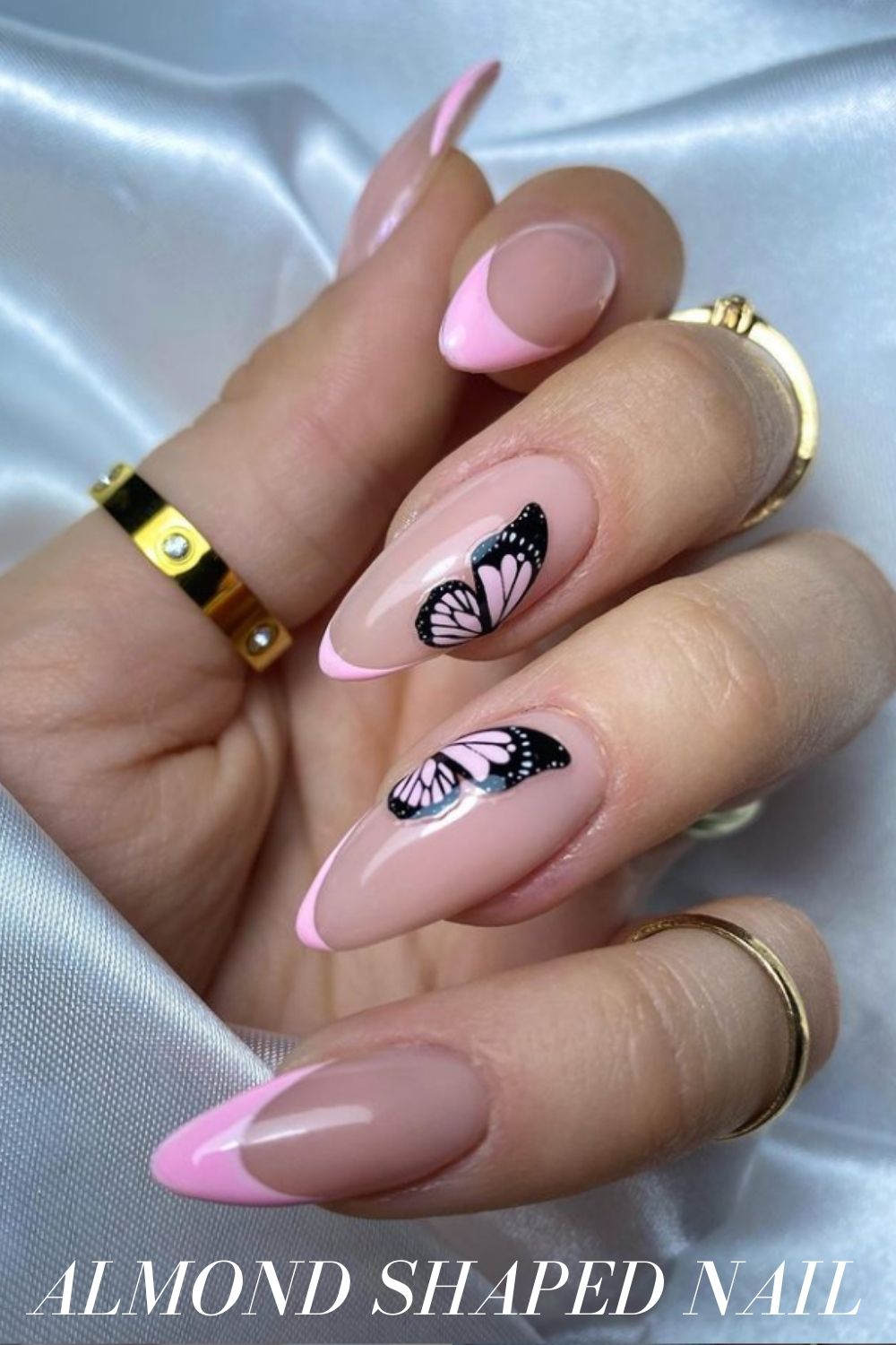 Pink almond nails with butterfly