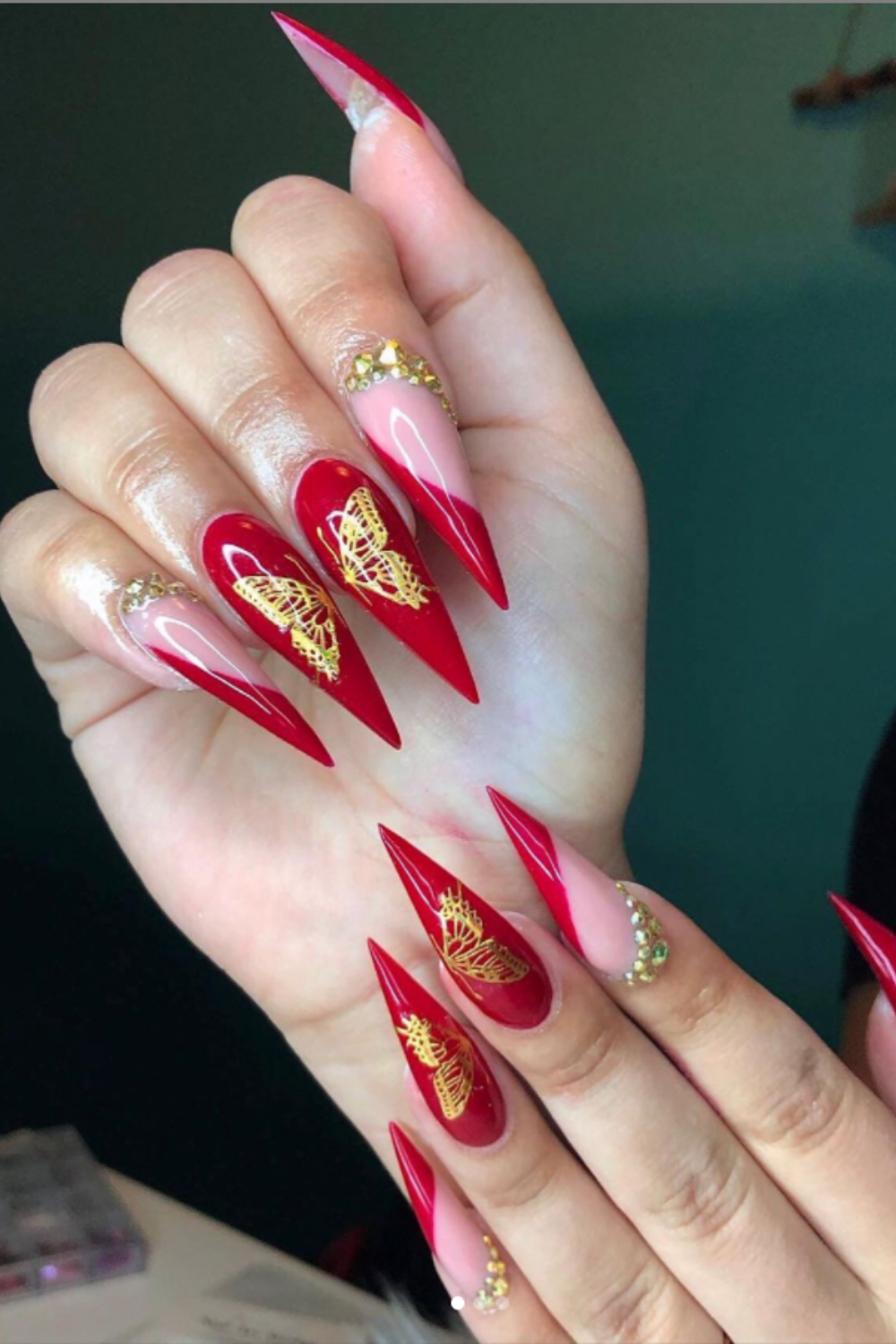 Stiletto nails designs with gold butterfly