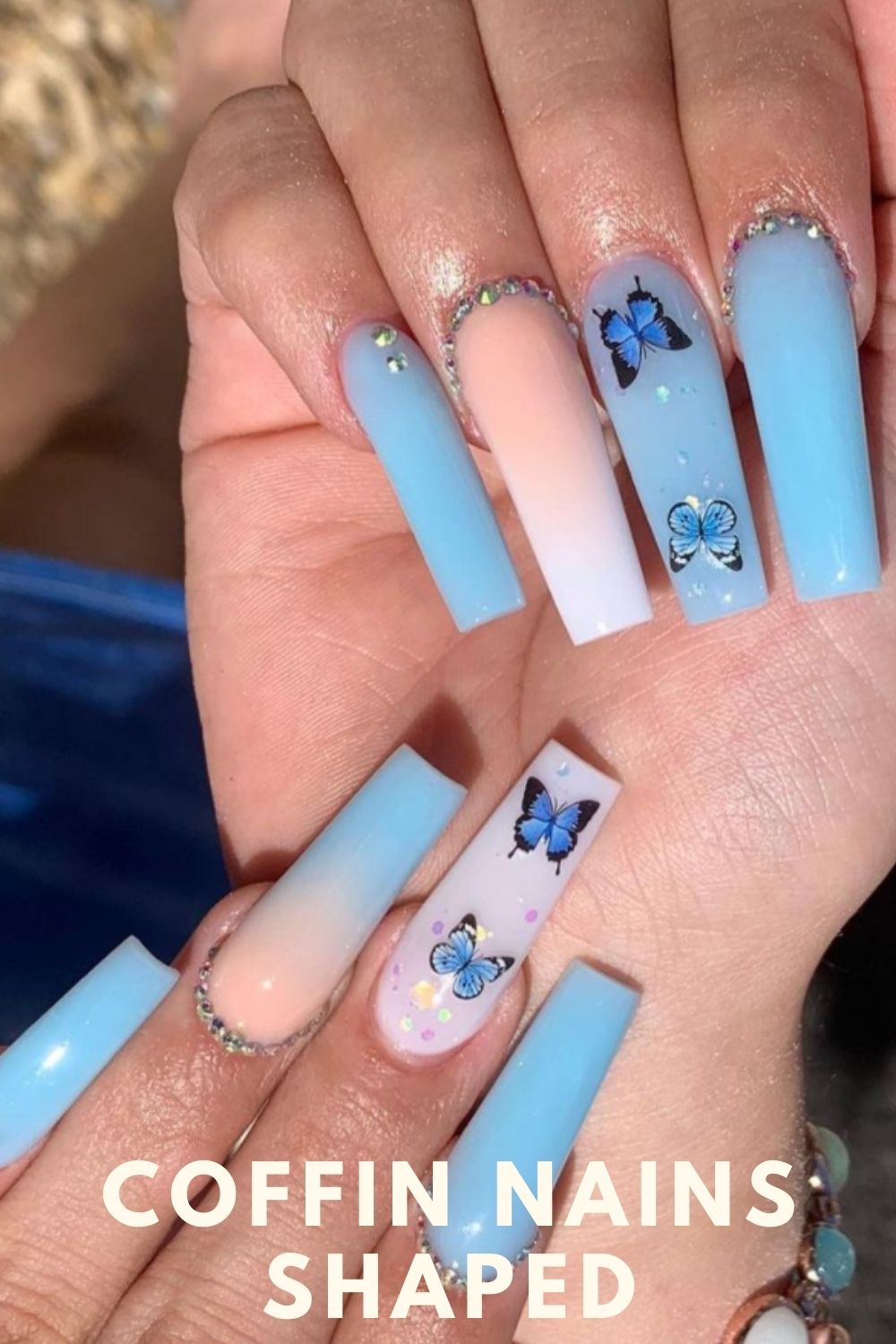 White and light blue coffin nails with butterfly