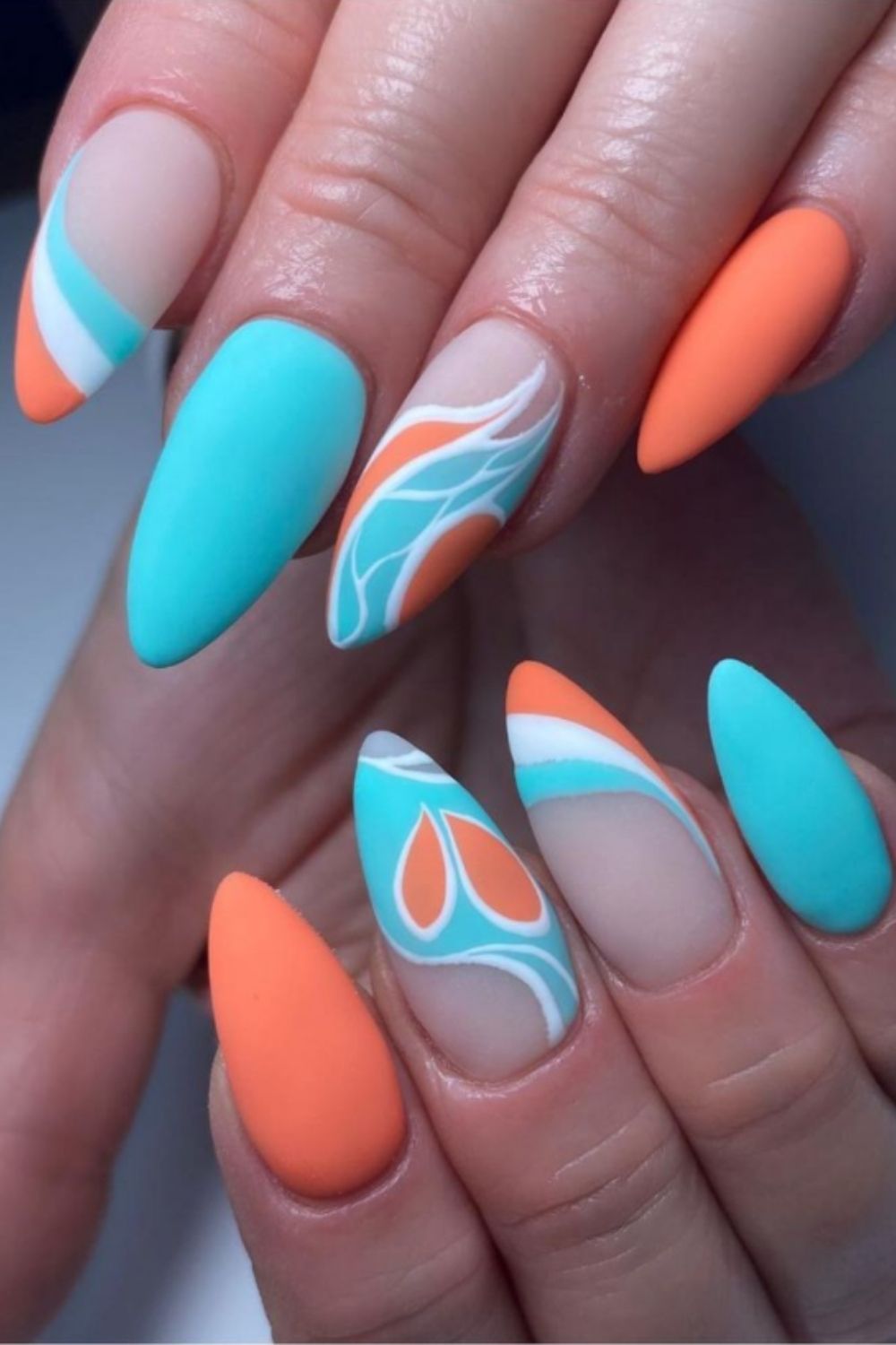 Light blue and orange almond nails art