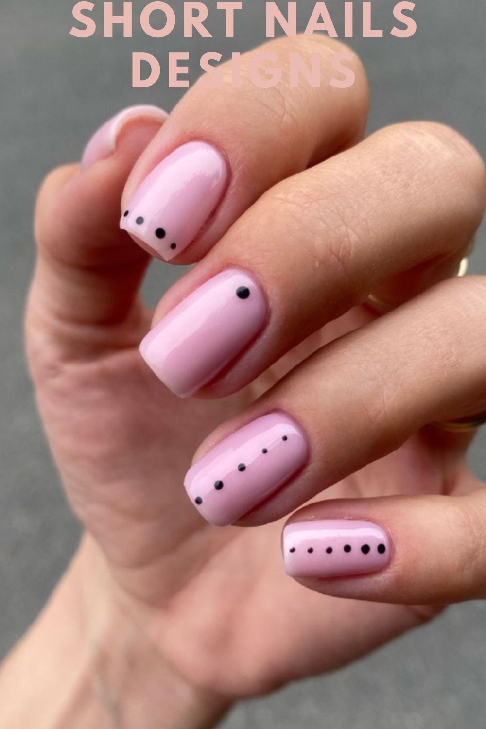 Pink and small black dot nails designs