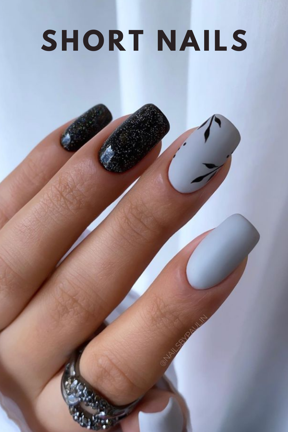 White and glitter black short nail art designs