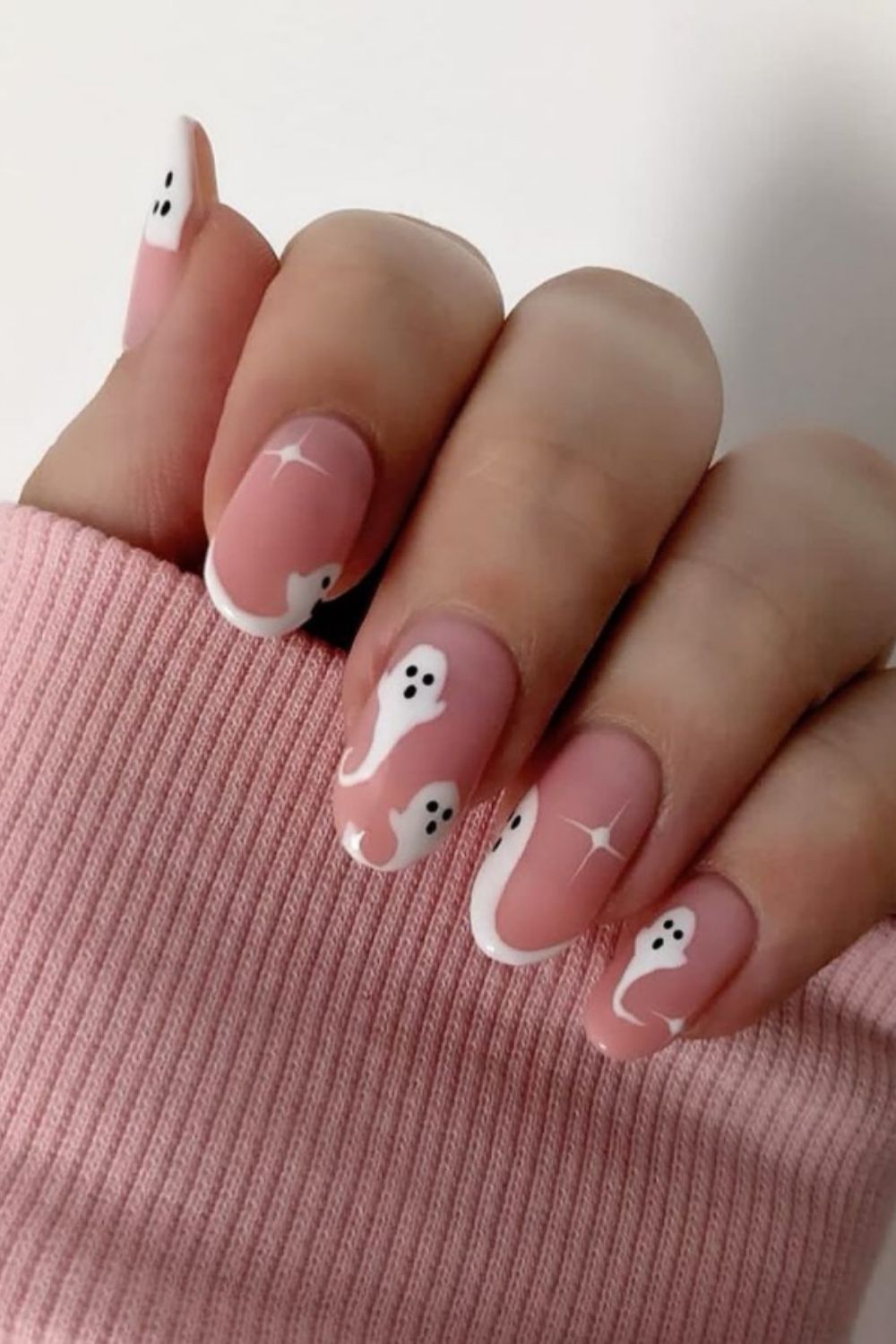 Pink and white Halloween nail art designs