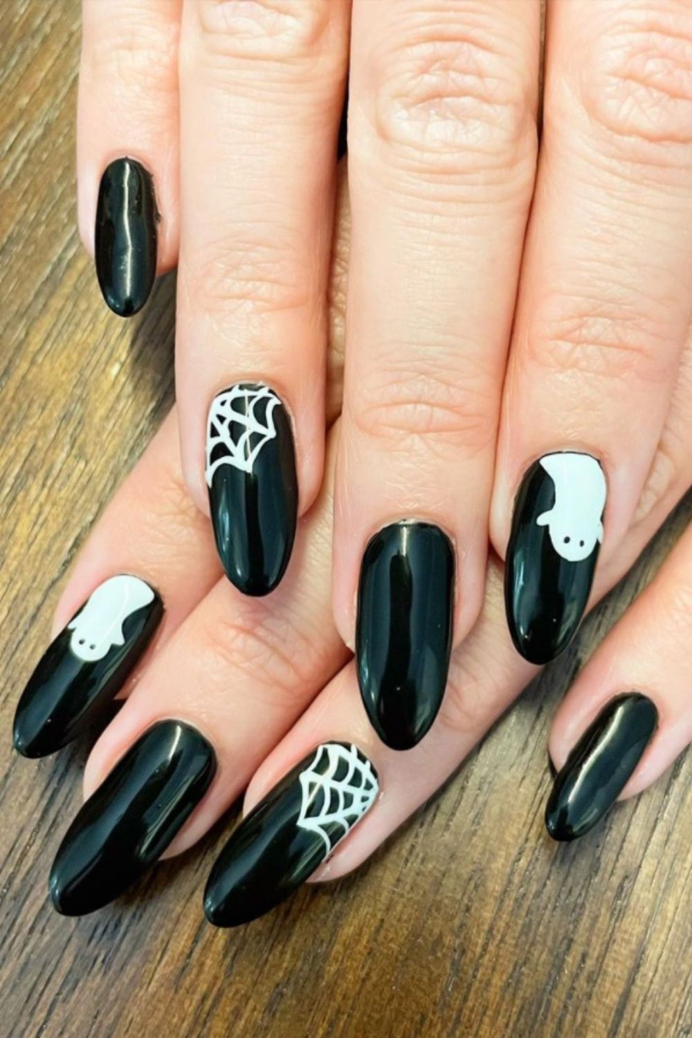 Black spider web nail design