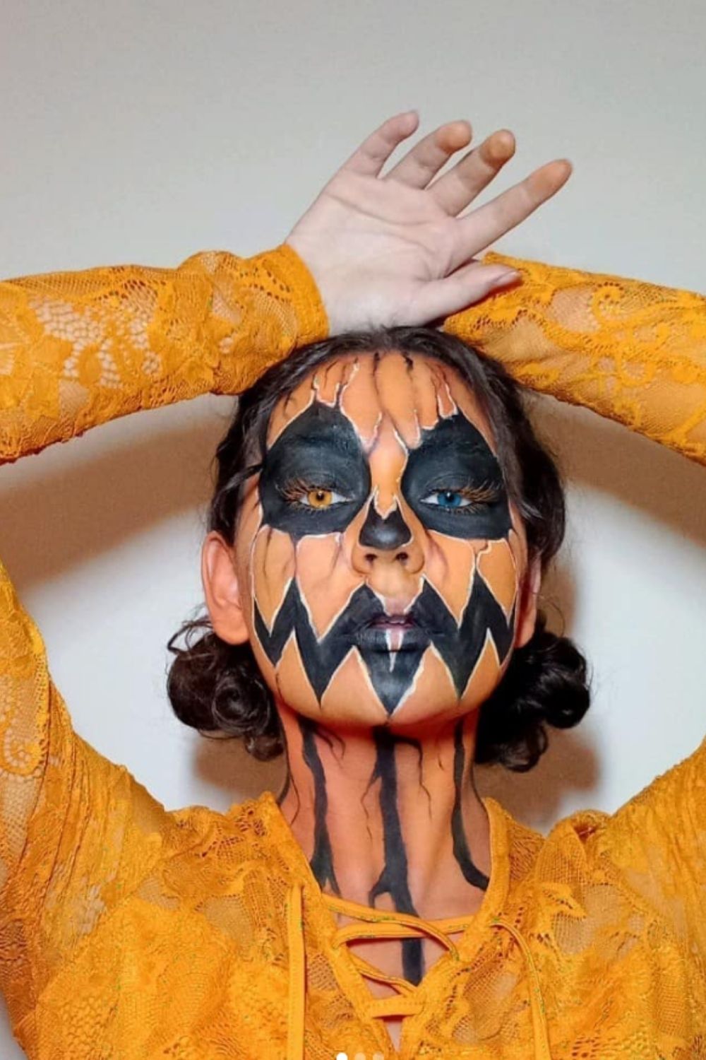 Orange and black pumpkin makeup design